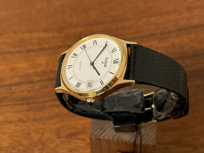 (1990) Pulsar Y552-8009 dress watch - gold colored case - white dial w/ black Roman numerals (NOS)