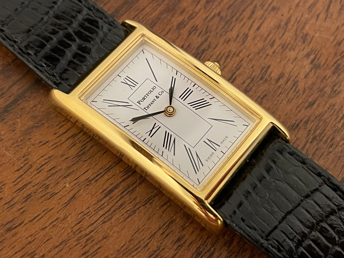 (1998) Tiffany & Co. Portfolio "Tank" dress watch - gold case - white dial w/ black Roman numerals (Mint)