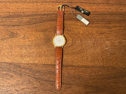 (2003) Pulsar V532-8B40 dress watch - gold colored case - white dial w/ gold markers (NOS)