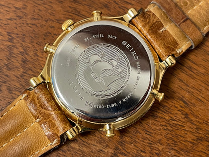 (1994) Seiko 6m13-0010 Age of Discovery (AOD) Perpetual Calendar - gold colored case - white dial w/ black Roman numerals