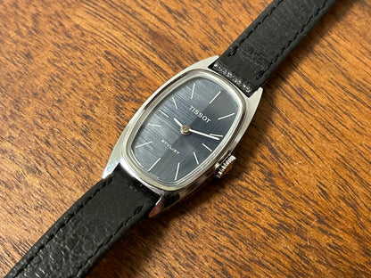 (1970s) Tissot HZ-10720 Stylist dress watch - silver tonneau case - blue brushed dial w/ silver stick markers - small size (NOS)