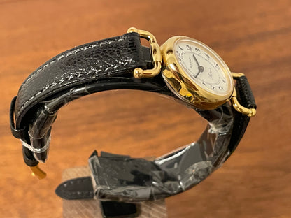 (1980s/1990s) Bulova Paris dress watch - oval case - cream dial w/ black Arabic numerals - small size (NOS)