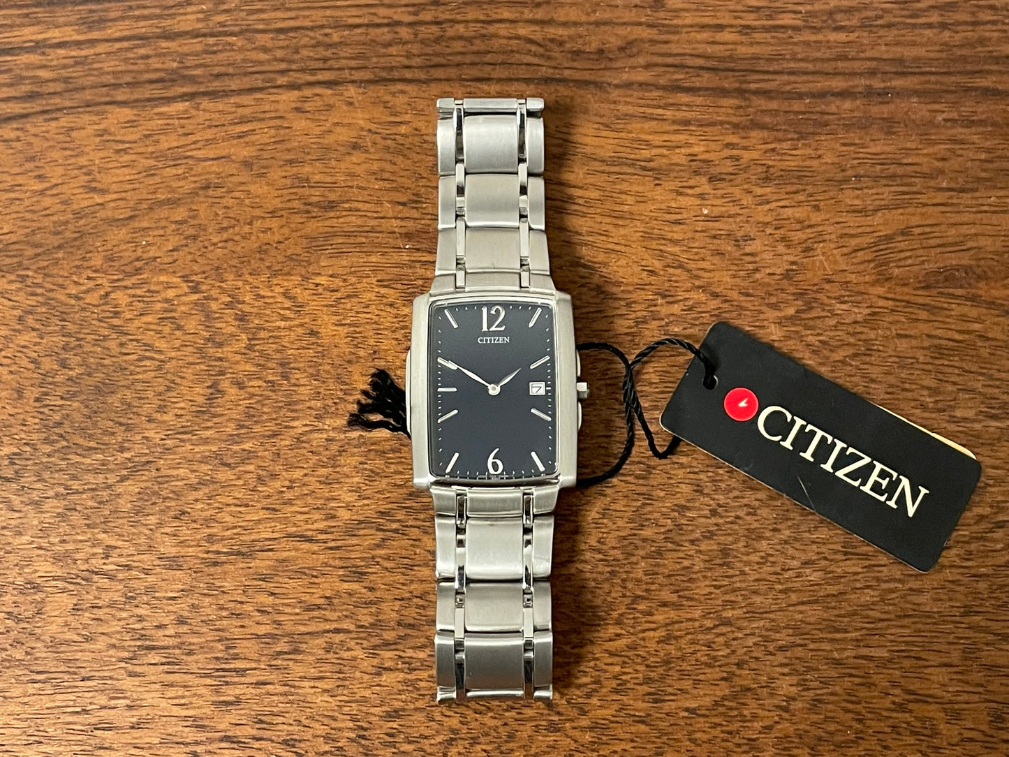 (1990) Citizen 1015-H23389 - integrated bracelet - black dial w/ silver Arabic numerals & markers (NOS)