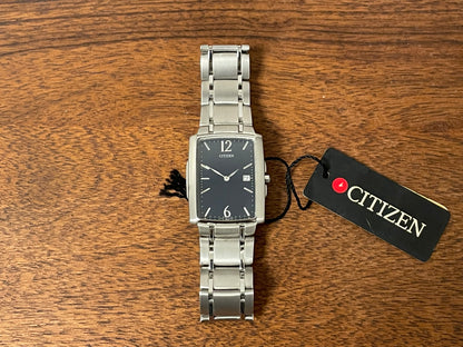 (1990) Citizen 1015-H23389 - integrated bracelet - black dial w/ silver Arabic numerals & markers (NOS)