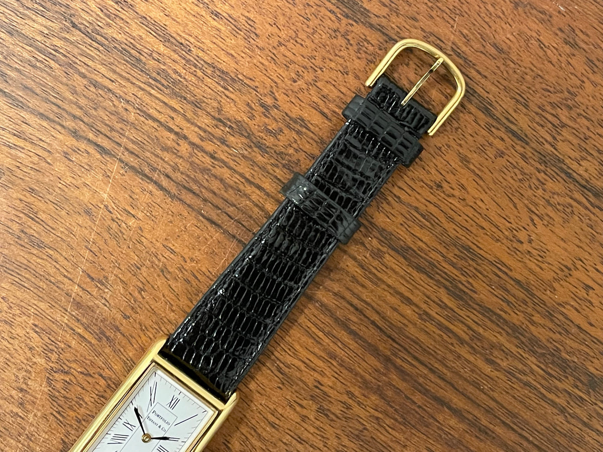 (1998) Tiffany & Co. Portfolio "Tank" dress watch - gold case - white dial w/ black Roman numerals (Mint)