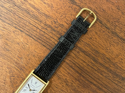(1998) Tiffany & Co. Portfolio "Tank" dress watch - gold case - white dial w/ black Roman numerals (Mint)