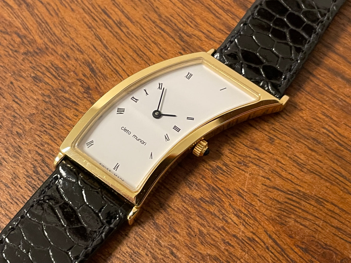 (1988) Cleto Munari "Parentesi" by Hans Hollein - asymmetrical 18K gold electroplated case - white dial w/ Roman numerals  (NOS + full set)