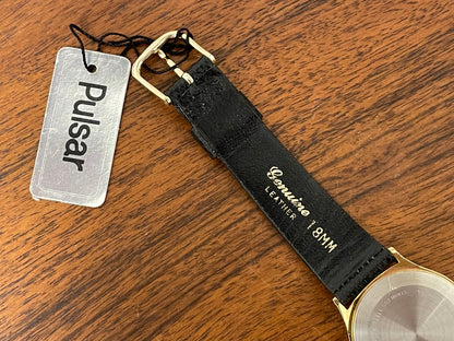 (1990) Pulsar Y552-8009 dress watch - gold colored case - white dial w/ black Roman numerals (NOS)
