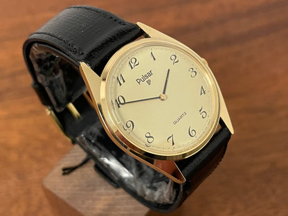 (1991) Pulsar Y480-0460 dress watch - gold colored case - matt champagne dial w/ black Arabic numerals - (NOS)
