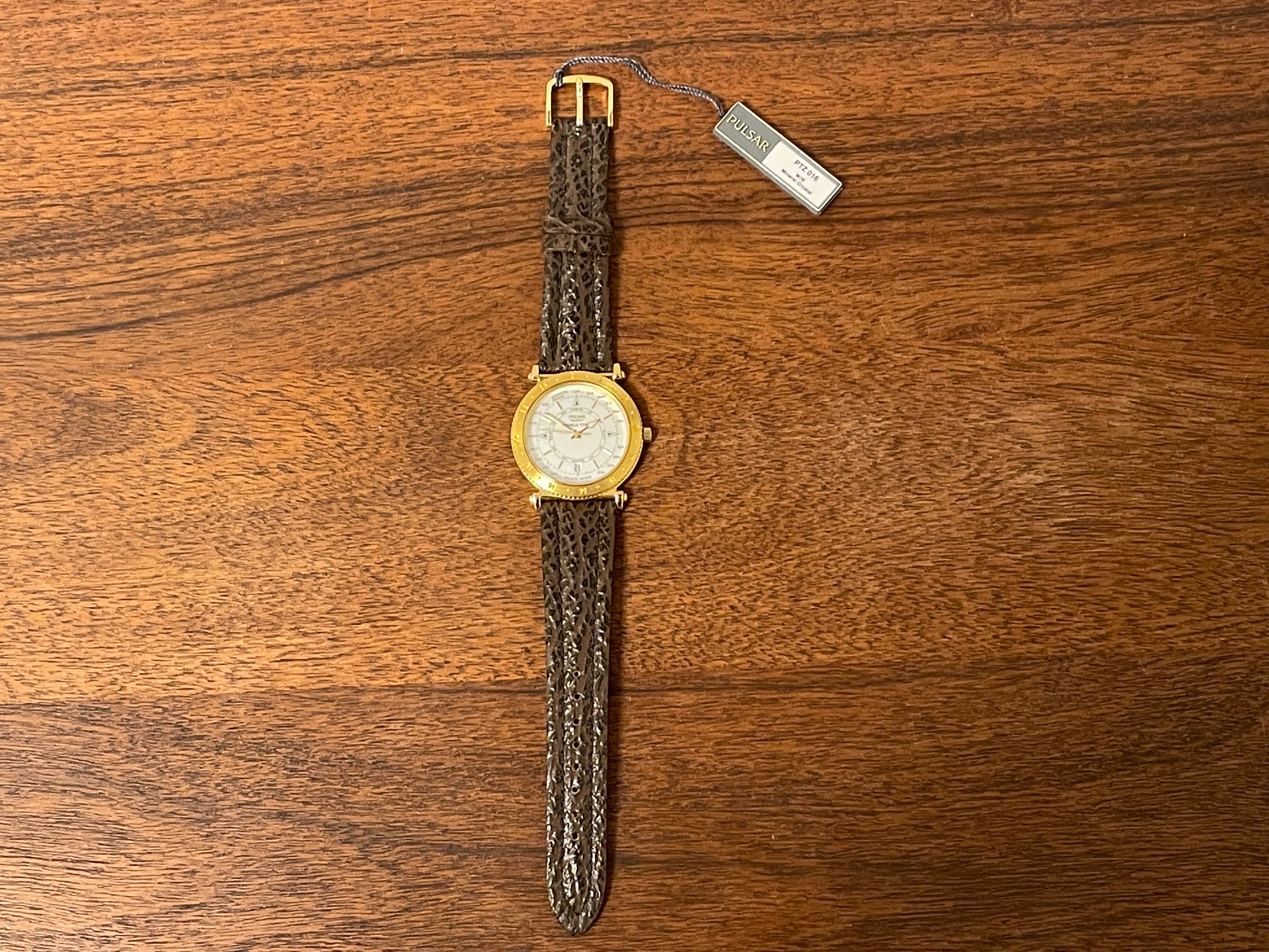 1992) Pulsar V722-7000 World Time - gold case - diamond dust dial