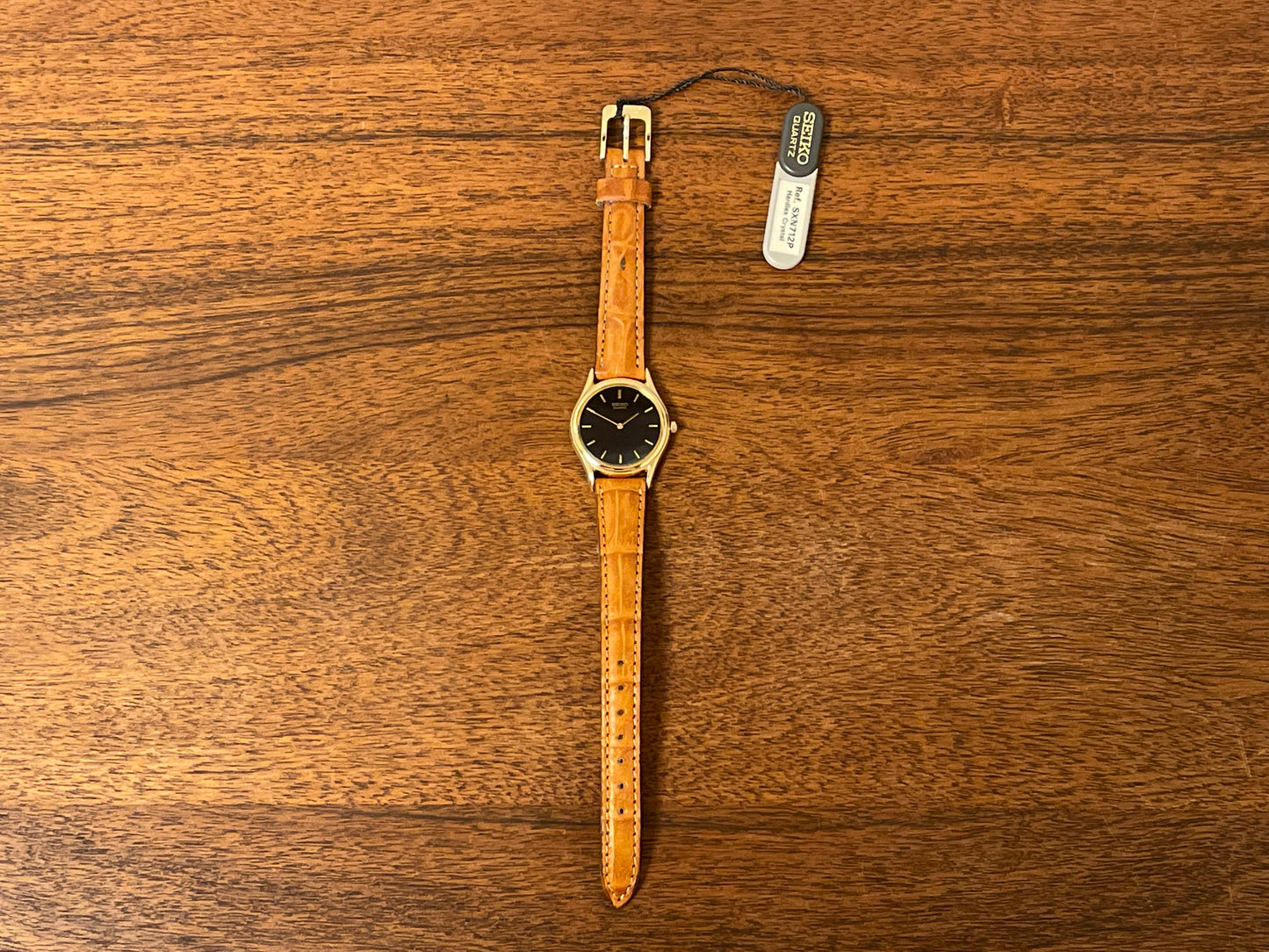 (1993) Seiko 4N00-0591 dress watch - gold bezel w/ black dial and gold markers - small size (NOS)