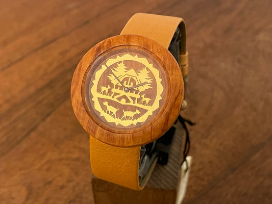 Front side (1990s) Tissot WoodWatch W195 - Mediterranean Briar case & dial w/ gold colored inlay - forest cabin (NOS)
