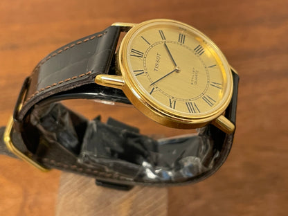 (1970s) Tissot 40771 Stylist dress watch - gold case - brushed gold dial w/ black Roman numerals (NOS)