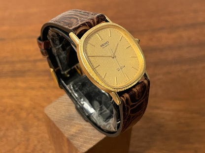(1981) Seiko 6030-5410 Dolce "Ellipse" - gold plated case w/ etched bezel - gold textured dial w/ gold markers