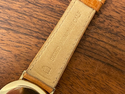 (1977) Seiko 43-0150 14K solid gold dress watch - rope bezel -  gold textured dial w/ gold markers