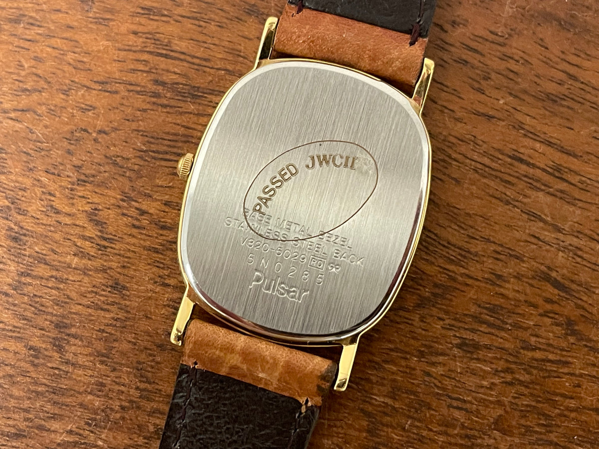 (1985) Pulsar V320-5029 "Ellipse" dress watch - gold case - diamond dust dial (NOS)