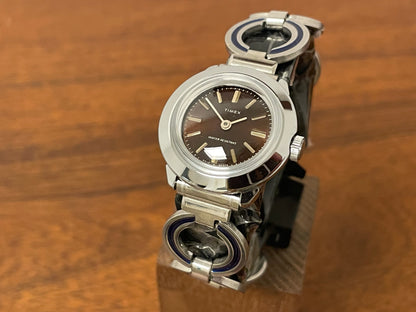 Front side (1970s) Timex 551-125 dress watch - silver case - brown dial w/ silver markers - small size (NOS + full set)