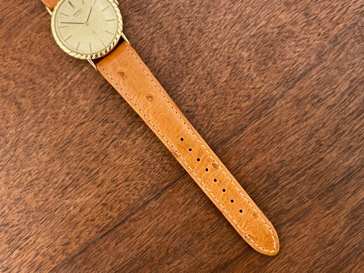 (1977) Seiko 43-0150 14K solid gold dress watch - rope bezel -  gold textured dial w/ gold markers