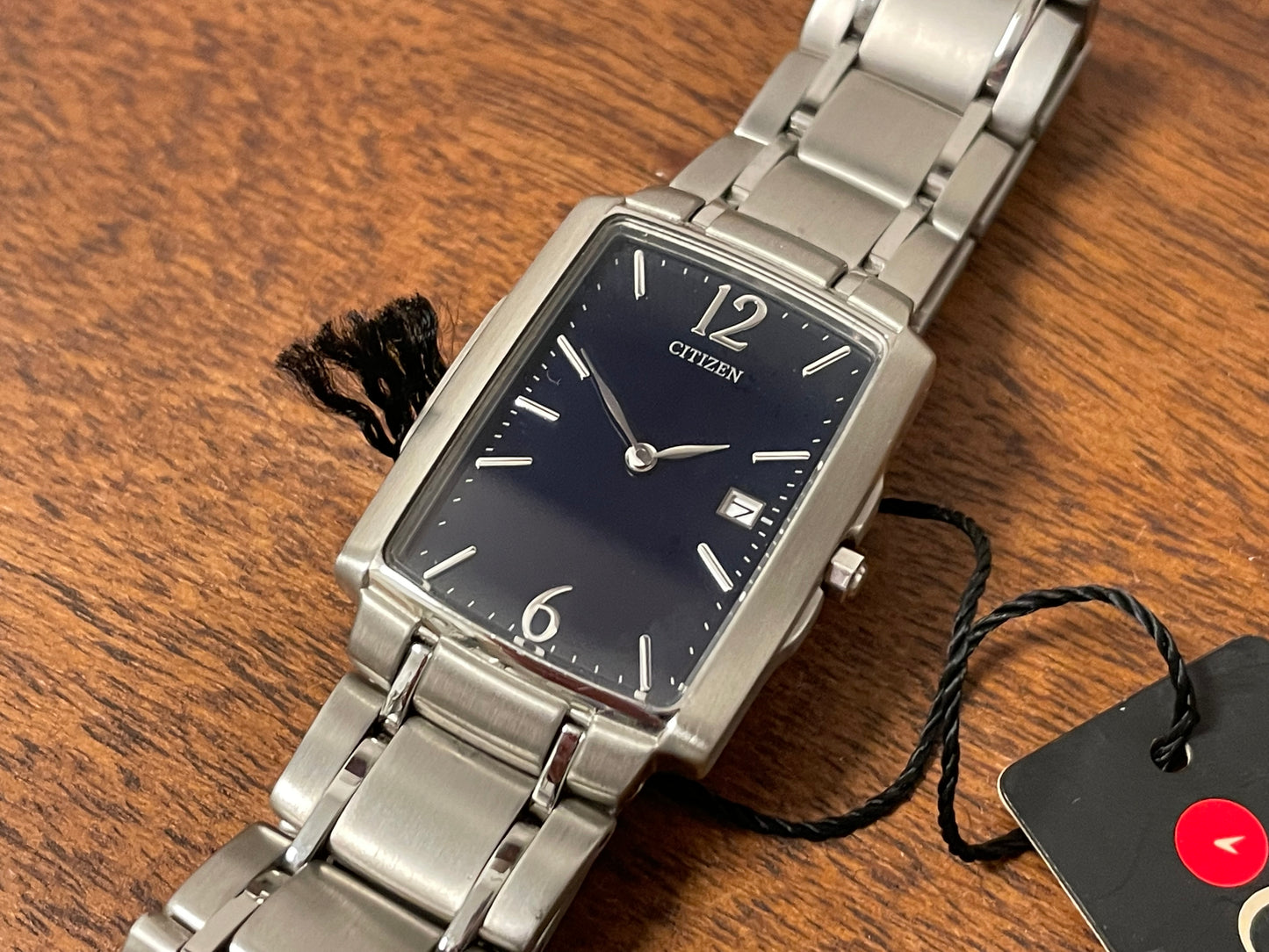 (1990) Citizen 1015-H23389 - integrated bracelet - black dial w/ silver Arabic numerals & markers (NOS)