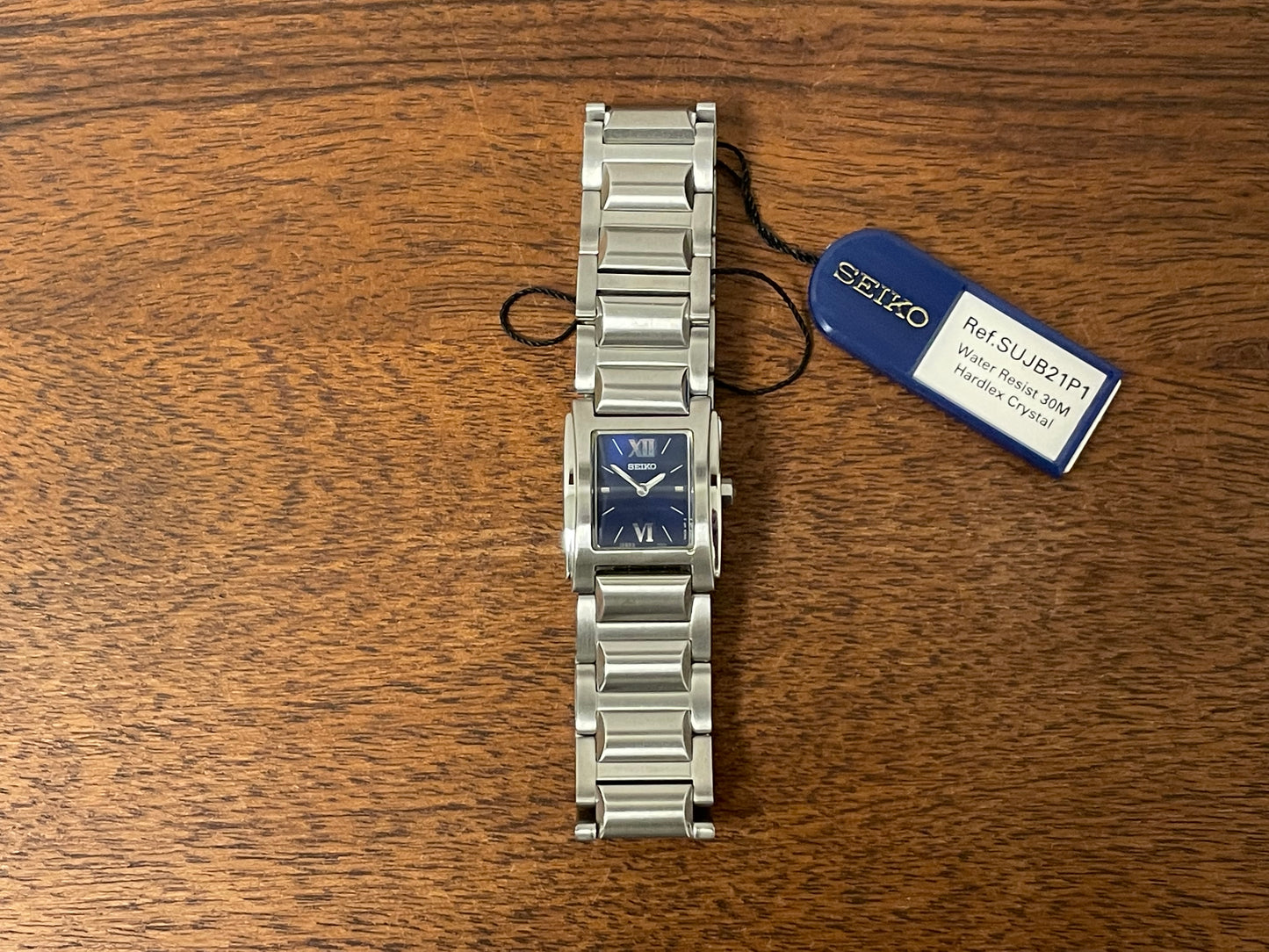 (1995) Seiko 1N00-OJH0 - "Tank" style case - blue dial w/ silver Roman numerals & markers - small size (NOS)