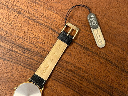 (1991) Seiko 7N00-8A00 dress watch - white dial w/ Roman numerals & Leafe hands (NOS)