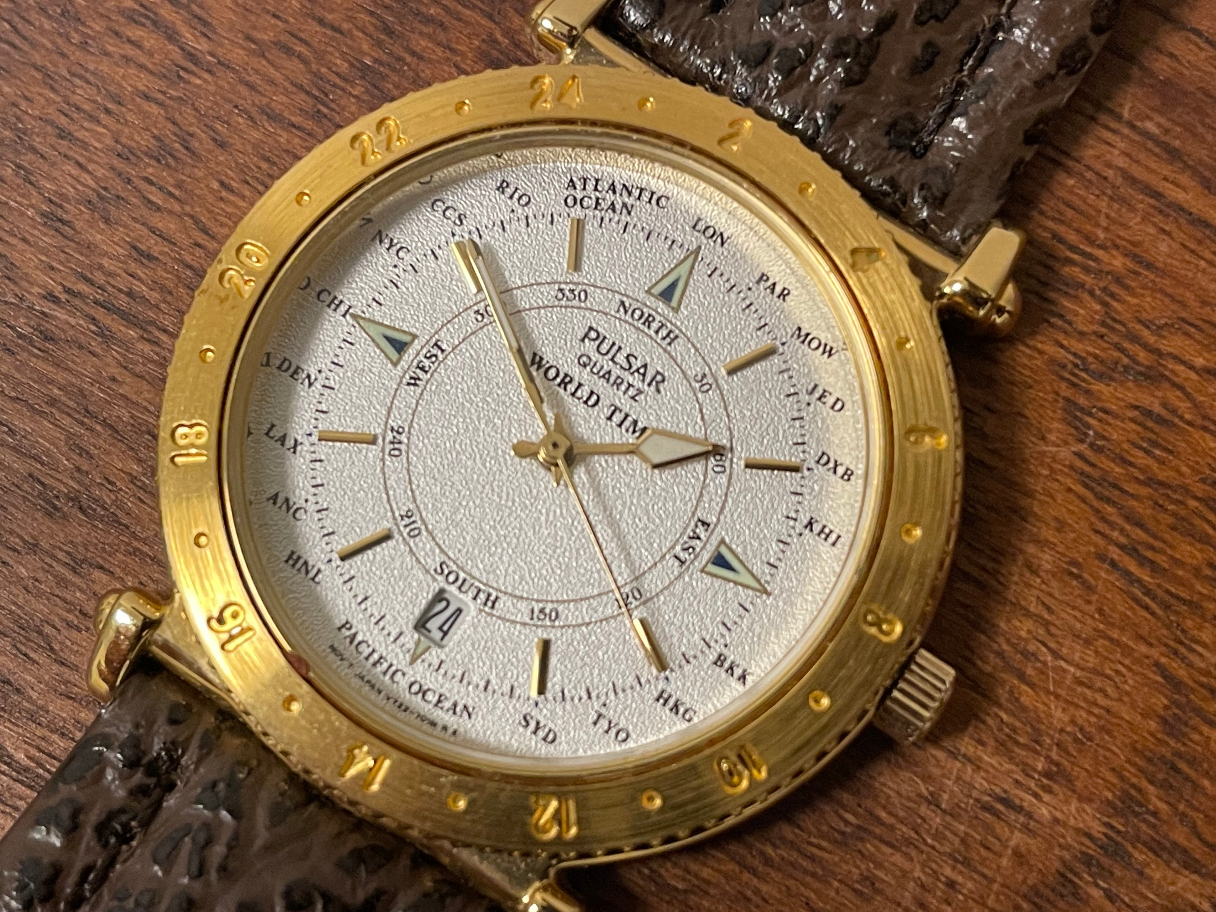 1992) Pulsar V722-7000 World Time - gold case - diamond dust dial