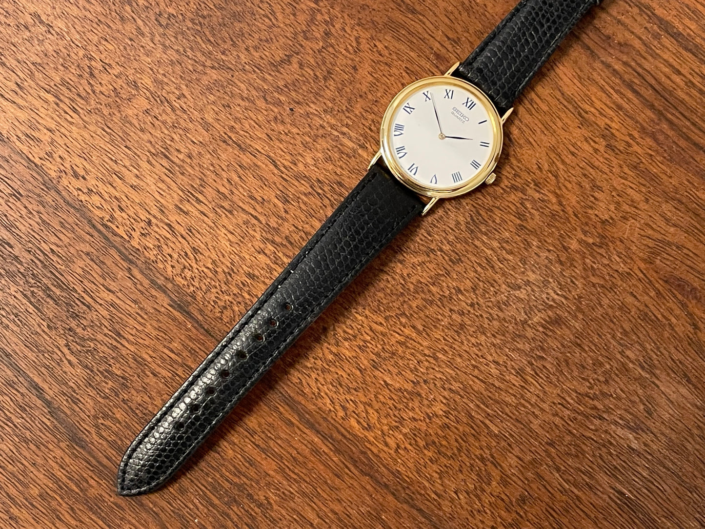 (1991) Seiko 7N00-8A00 dress watch - white dial w/ Roman numerals & Leafe hands (NOS)