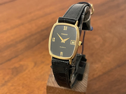 Front side (1970s) Tissot 642.33500/5 Stylist "Ellipse" dress watch - gold case - black dial w/ Roman numerals - small size (NOS)