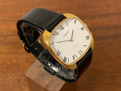 (1970s) Tissot Stylist dress watch - gold “tv case” - white dial w/ black Roman numerals (NOS)