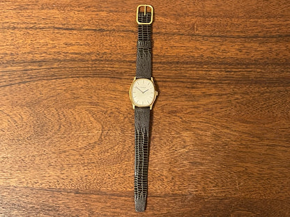 (1970s) Tissot 41141 "Ellipse" dress watch - gold case - silver brushed dial w/ gold stick markers (NOS)