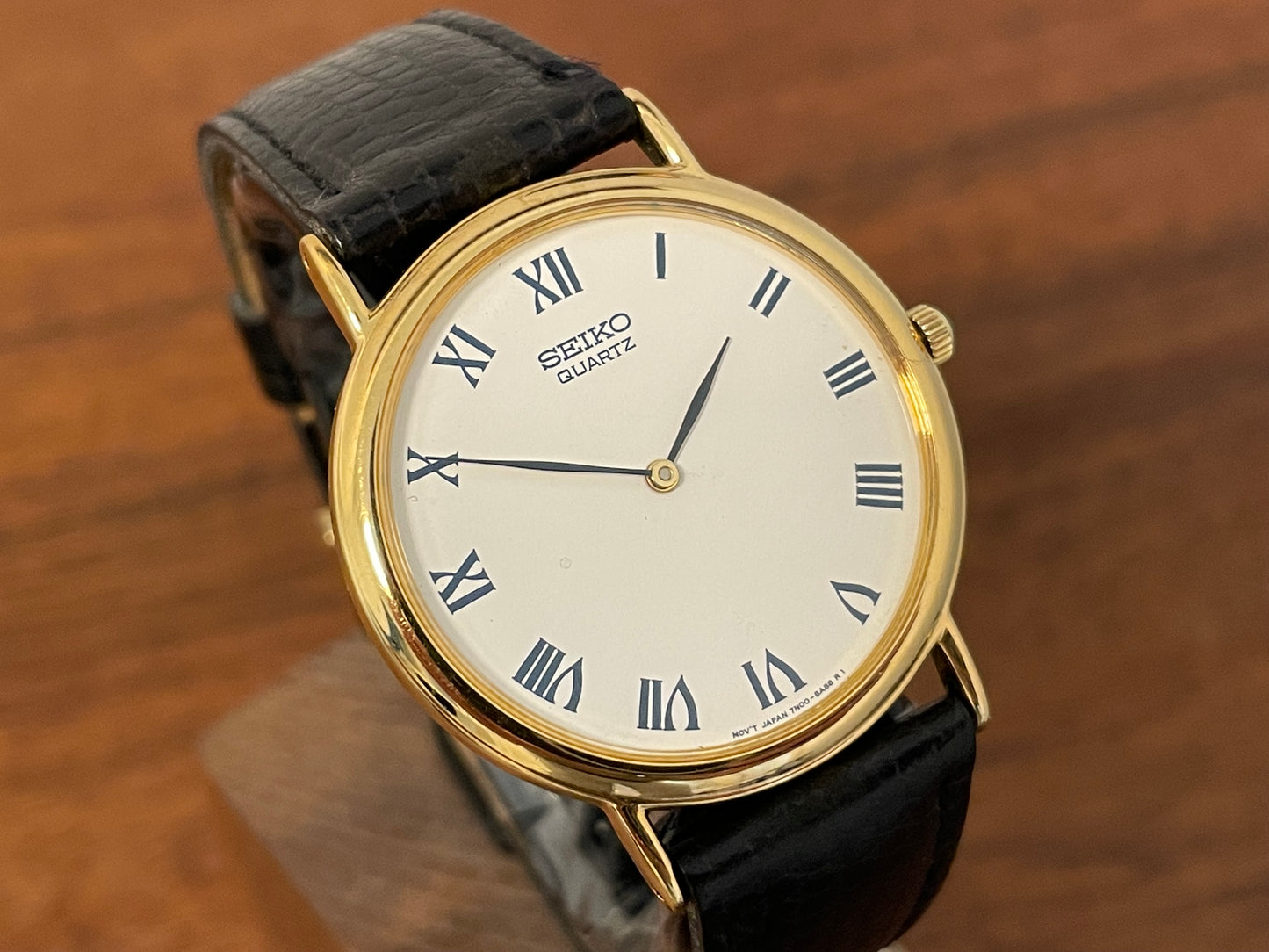 (1991) Seiko 7N00-8A00 dress watch - white dial w/ Roman numerals & Leafe hands (NOS)