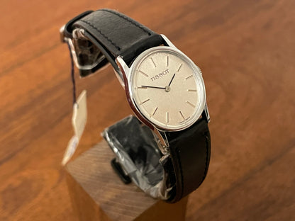 (1970s) Tissot 052-10991 Stylist dress watch - silver oval case - silverdust dial w/ silver stick markers - small size (NOS)