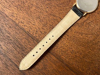 (2000) Seiko 5Y39-7010 dress watch - gold colored case - black dial w/ flat gold Arabic numerals (NOS)