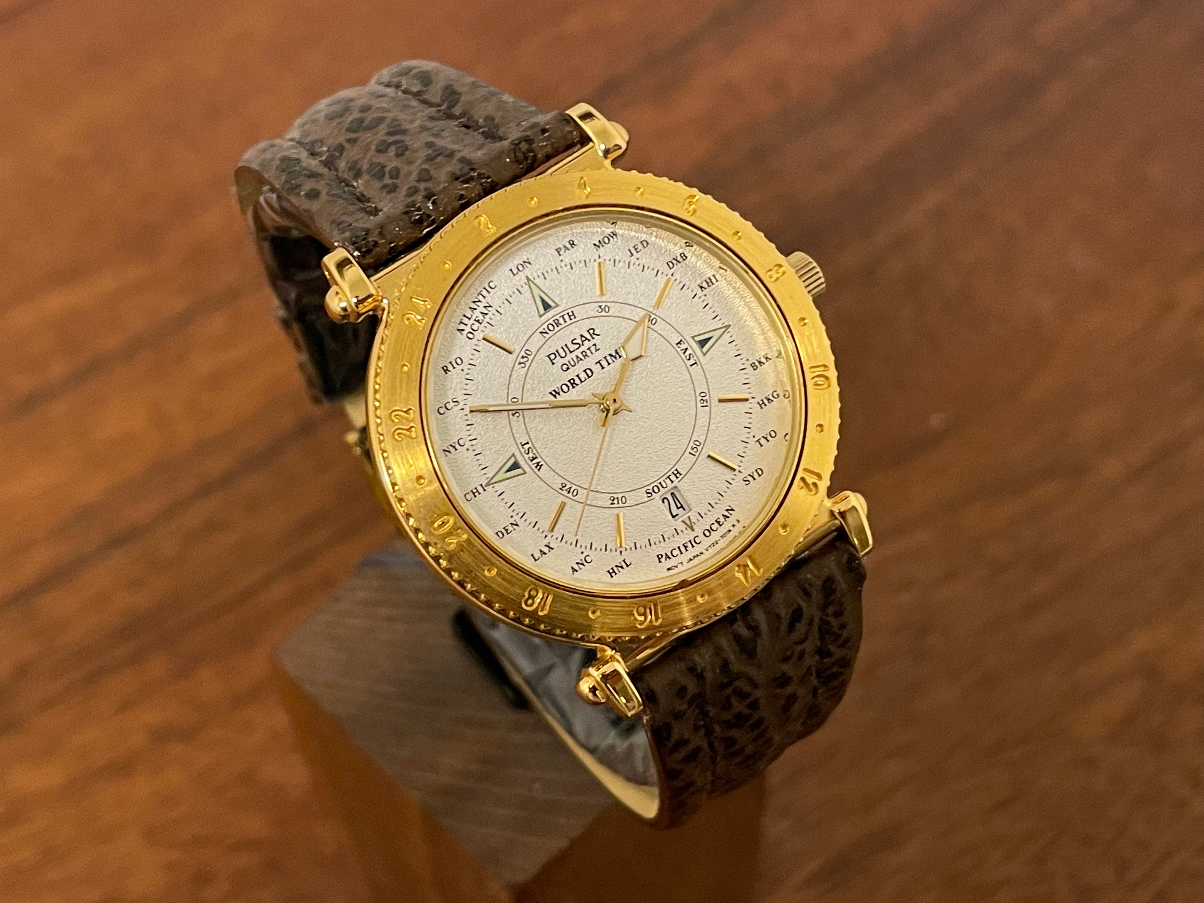 1992) Pulsar V722-7000 World Time - gold case - diamond dust dial