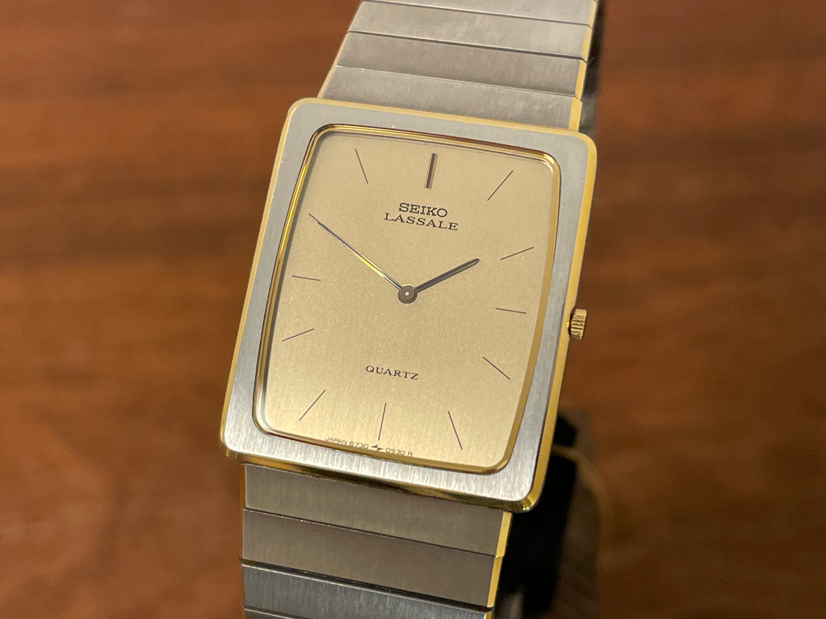 (1983) Seiko 6730-565H Lassale ultra thin - stainless steel bracelet - brushed gold dial w/ black stick markers (NOS)