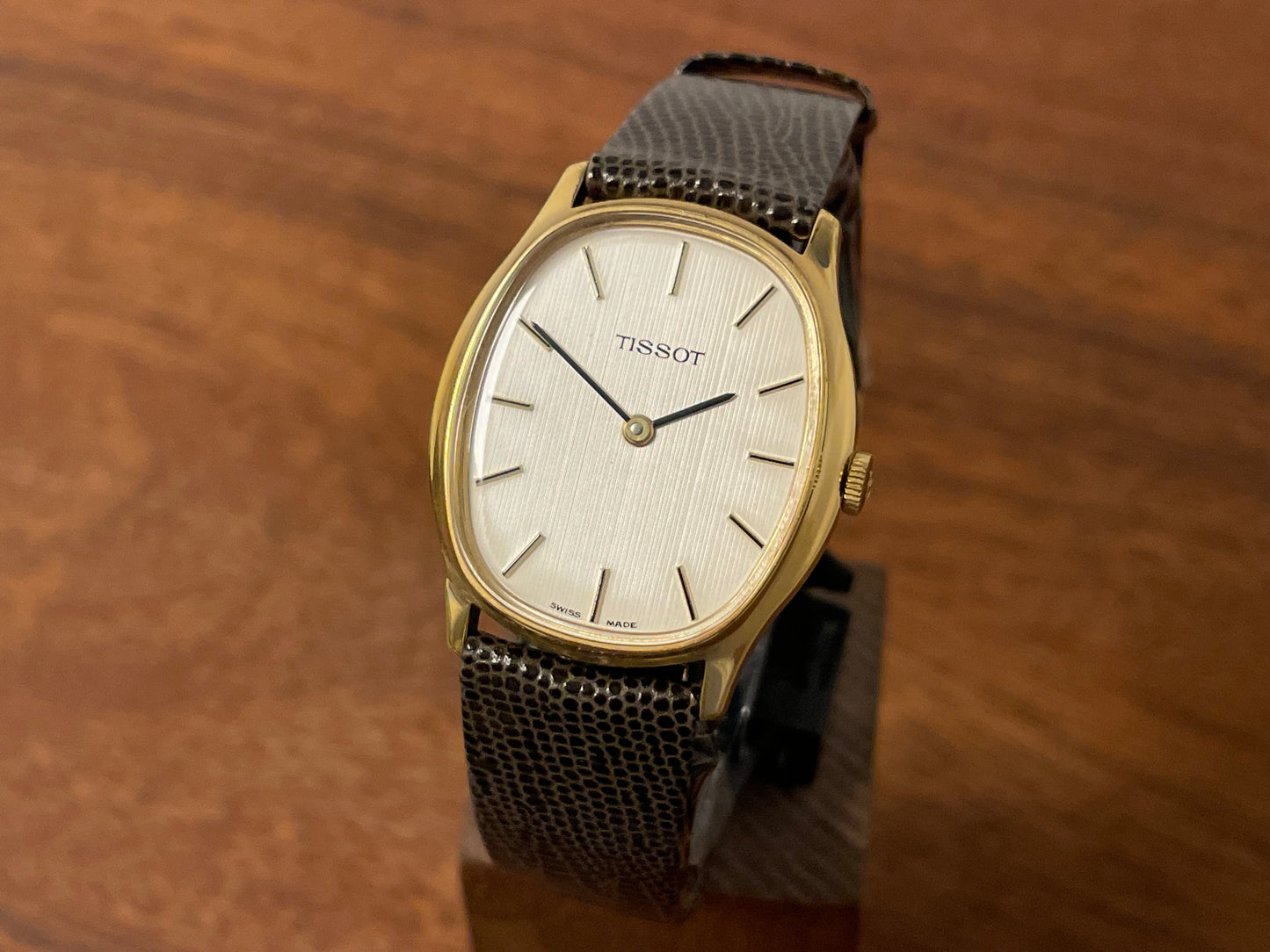 Front side (1970s) Tissot 41141 "Ellipse" dress watch - gold case - silver brushed dial w/ gold stick markers (NOS)