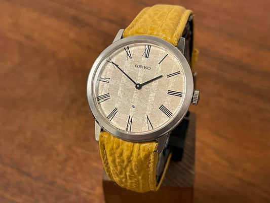 Front side (1976) Seiko 2220-0180 Chariot dress watch - silver textured waffle dial w/ Roman numerals