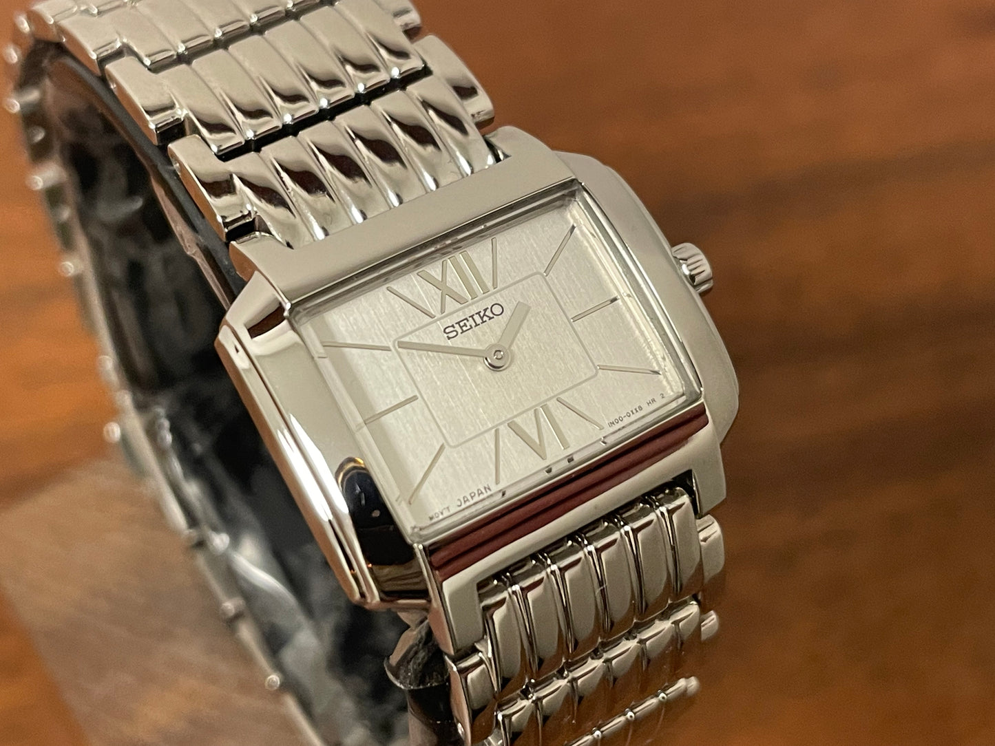 (1998) Seiko 1N00-0PT0 - rectangular case - silver dial w/ silver Roman numerals & markers - small size (NOS)