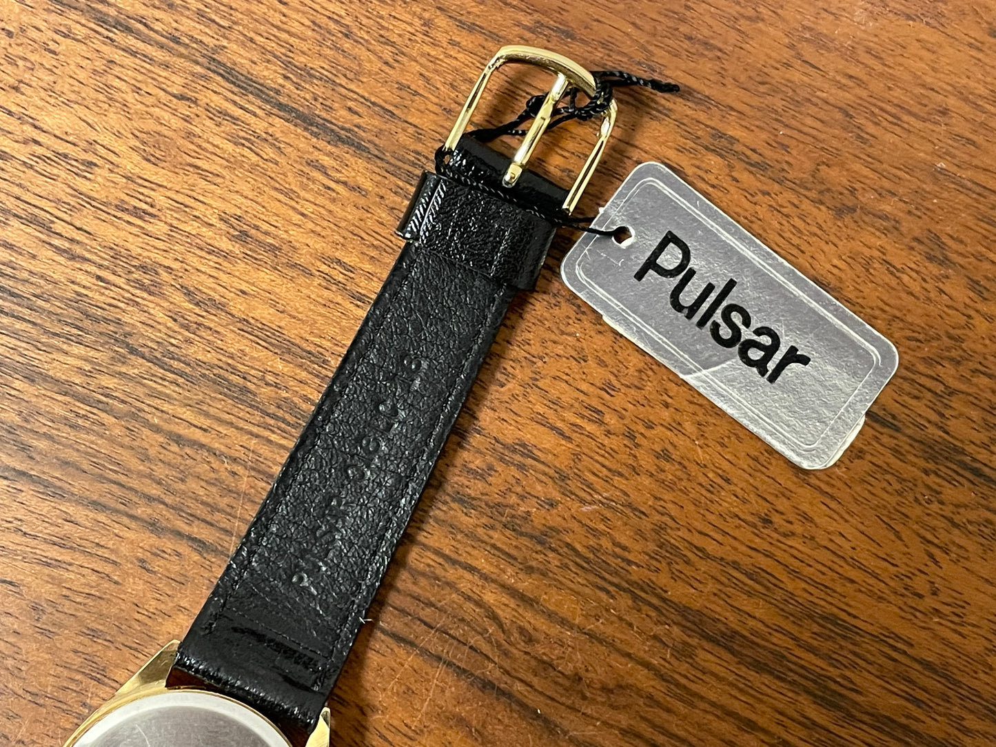 (1991) Pulsar Y480-0460 dress watch - gold colored case - matt champagne dial w/ black Arabic numerals - (NOS)