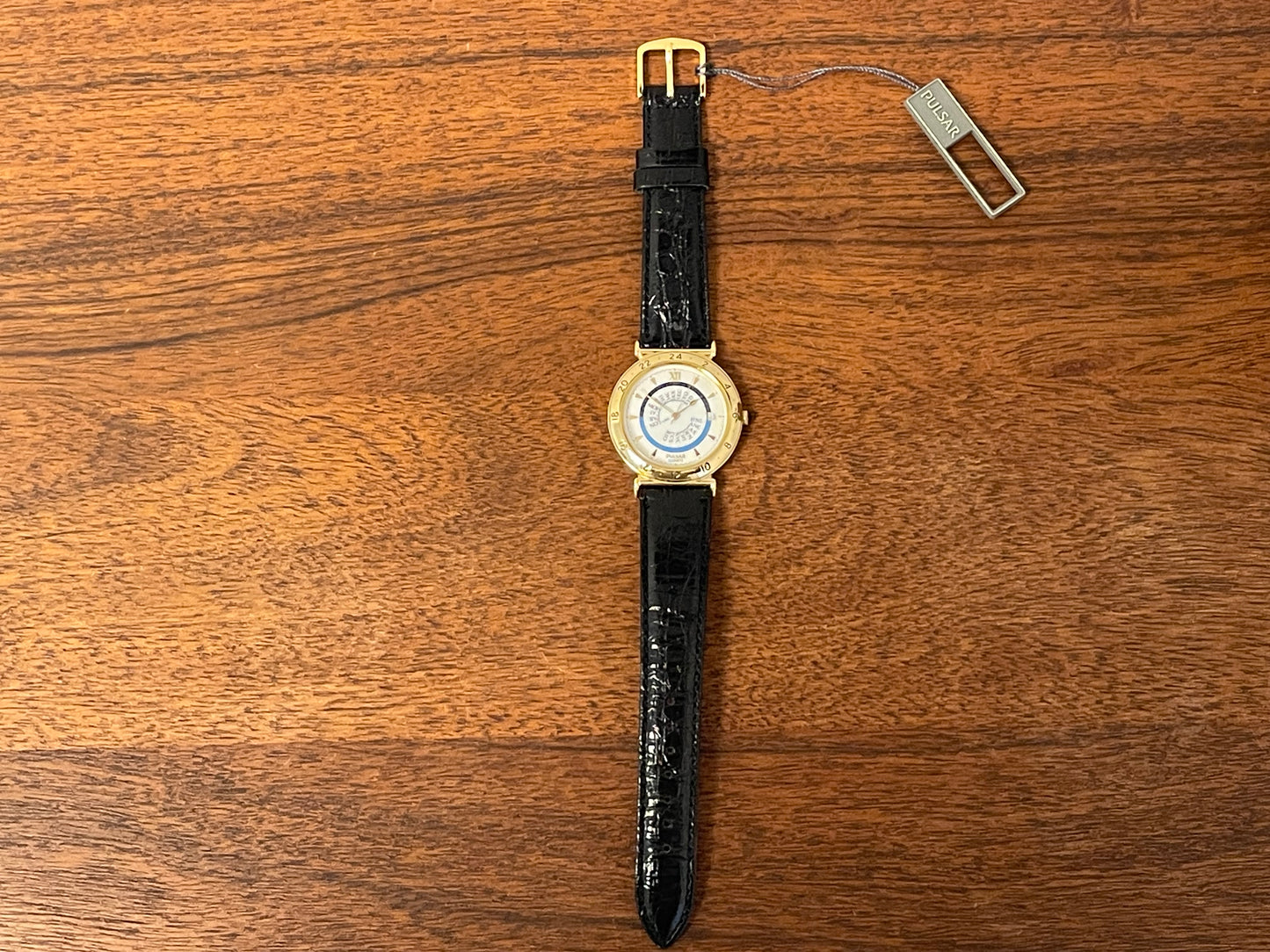 (1999) Pulsar V339-6000 world Timer - gold case - rotating white dial w/ gold markers (NOS)
