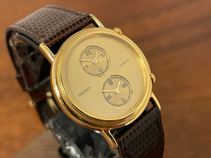 (1985) Seiko 1E20-0160 dual time dress watch - round case - gold textured dial w/ 2 subdials