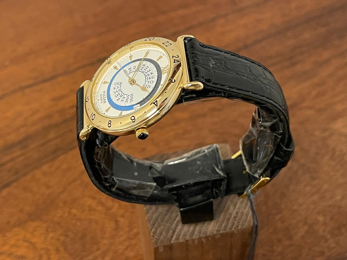 (1999) Pulsar V339-6000 world Timer - gold case - rotating white dial w/ gold markers (NOS)