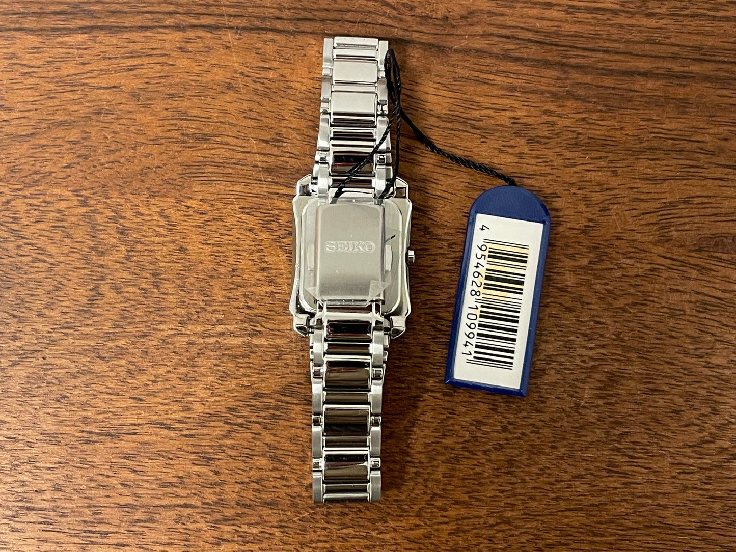 (1999) Seiko 7N01-0FW0  - "Tank" style case - silver dial w/ silver Roman numerals - small size (NOS)