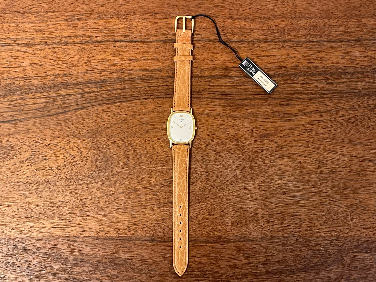 (1985) Pulsar V320-5029 "Ellipse" dress watch - gold case - diamond dust dial (NOS)