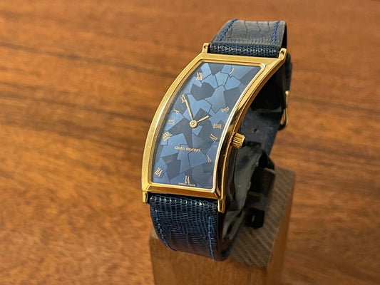 Front side Cleto Munari "Parentesi" by Hans Hollein - asymmetrical 18K gold electroplated case - blue enamel dial in new old stock (NOS) condition