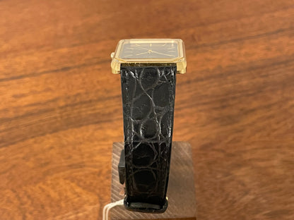 (1977) Ricoh 702009 quartz "Tank" dress watch - black dial w/ gold markers (NOS)