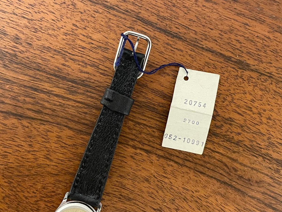 (1970s) Tissot 052-10991 Stylist dress watch - silver oval case - silverdust dial w/ silver stick markers - small size (NOS)