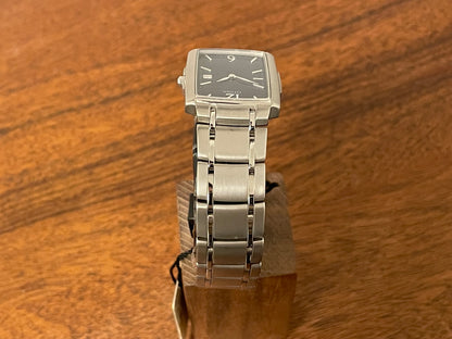 (1990) Citizen 1015-H23389 - integrated bracelet - black dial w/ silver Arabic numerals & markers (NOS)