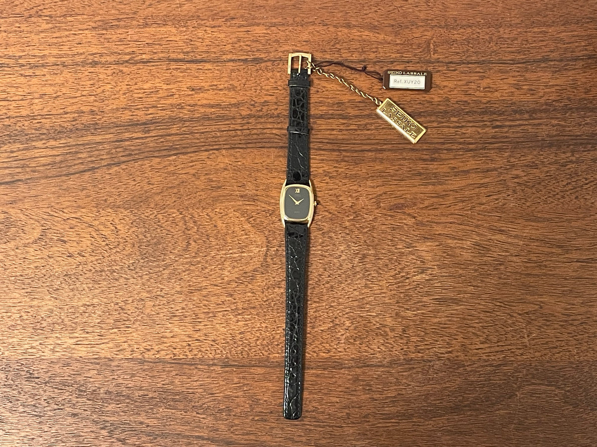 (1980) Seiko 1400-7249 Lassale "Ellipse" dress watch - black dial w/ gold Roman numerals - small size (NOS)