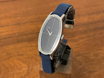 Front side (1970s) Timex 519-105 dress watch - elongated oval case - black cross dial  - small size (NOS + full set)